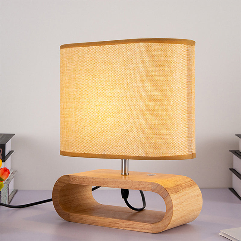 Nachttischlampe aus Holz mit ovalem Sockel und Stoffschirm