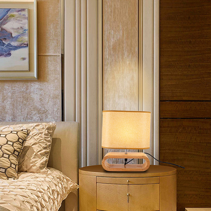 Nachttischlampe aus Holz mit ovalem Sockel und Stoffschirm